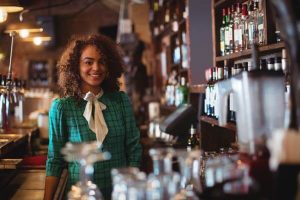 Woman behind bar