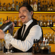 Freepik-medium-shot-bartender-preparing-drink Image of a happy bartender at bartending school - Freepik